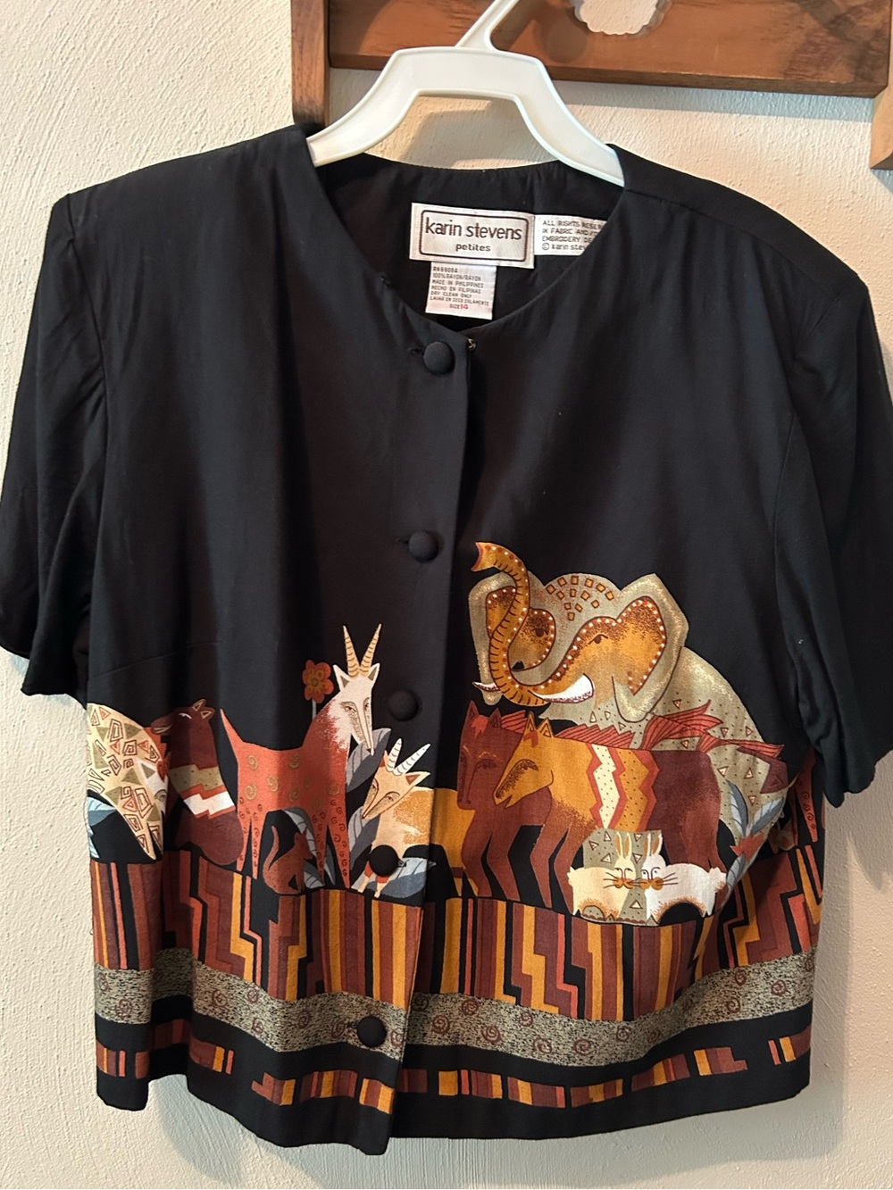 karin stevens black rayon 14 petite blouse, 5 button. Animals front, & back.